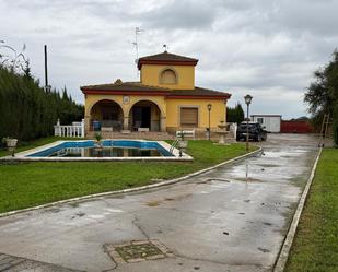 Exterior view of House or chalet for sale in Huévar del Aljarafe  with Private garden, Storage room and Swimming Pool