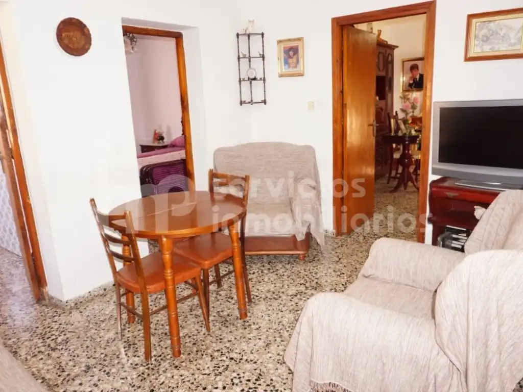 Sala de estar de Casa adosada en venta en Benamocarra con Jardín privado, Terraza y Amueblado