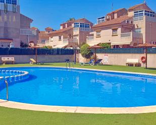 Swimming pool of Single-family semi-detached for sale in Torrevieja  with Air Conditioner, Terrace and Furnished
