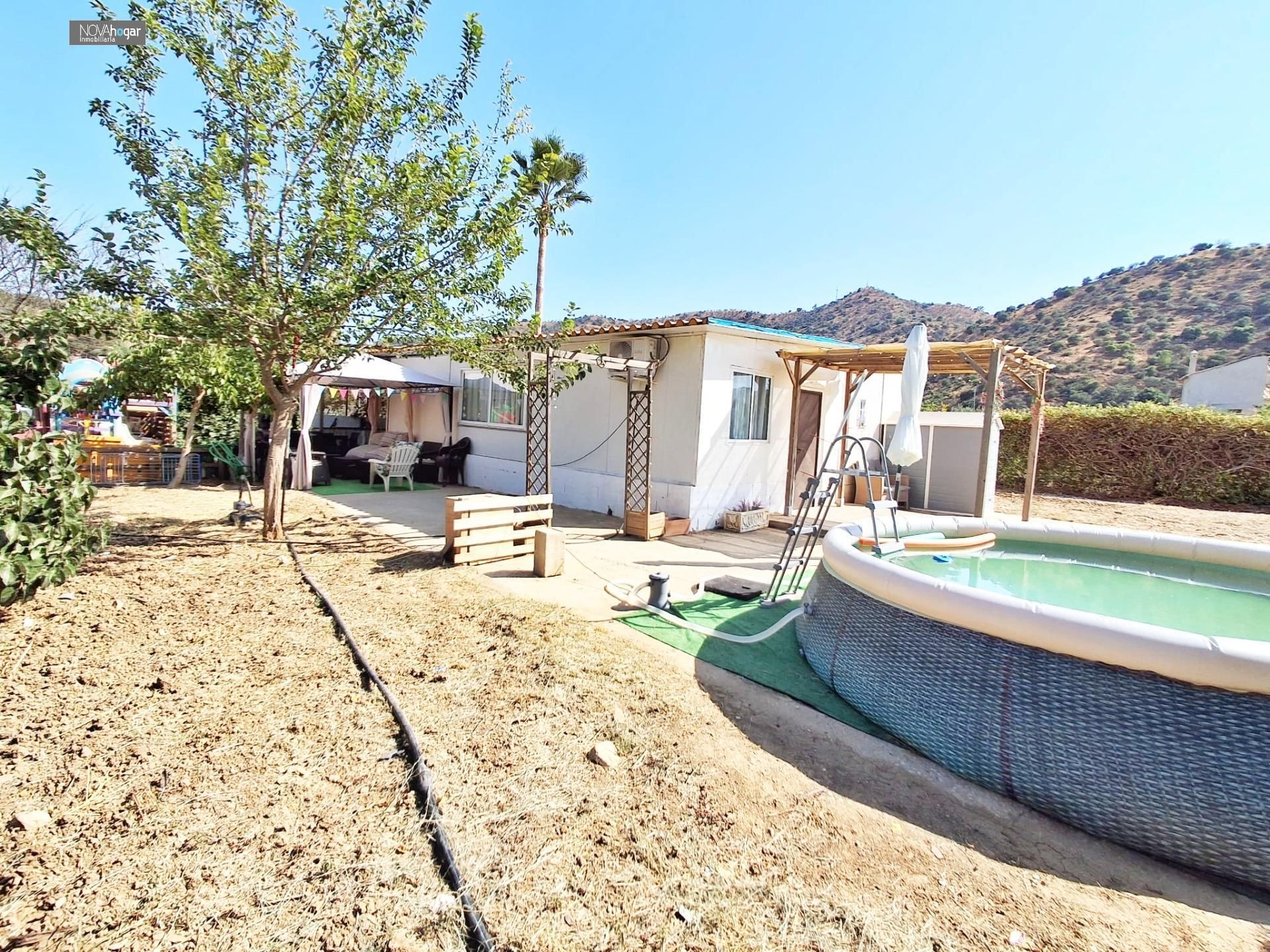 Vista exterior de Finca rústica en venda en Pizarra amb Jardí privat
