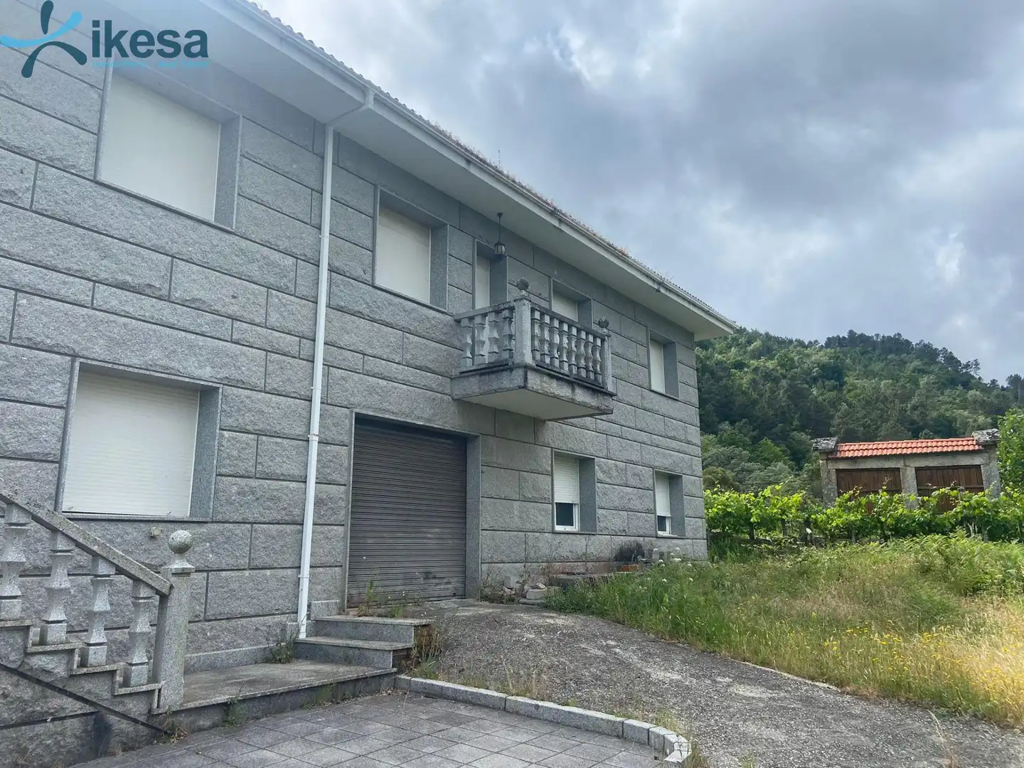 Vista exterior de Casa o xalet en venda en Entrimo amb Jardí privat