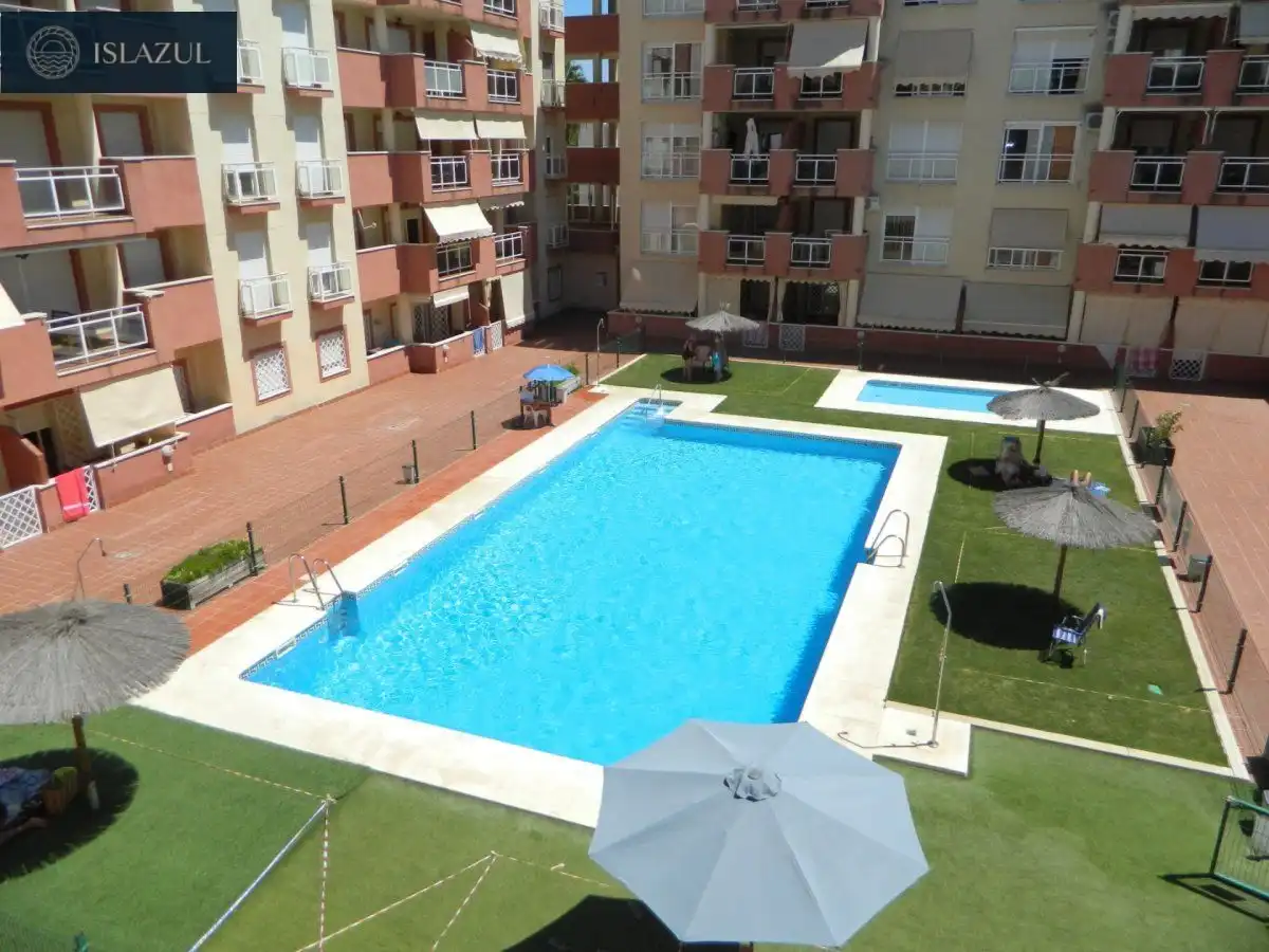 Piscina de Dúplex de alquiler en Isla Cristina con Terraza, Balcón y Piscina comunitaria