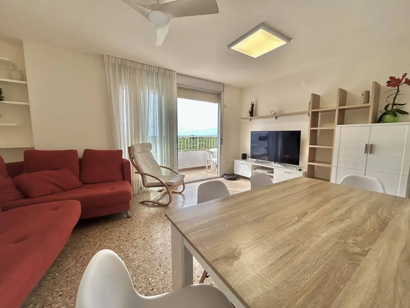 Sala d'estar de Apartament de lloguer en La Pobla de Farnals amb Moblat i Piscina comunitària