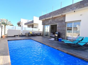 Casa aparellada amb piscina en venda a Orihuela Costa