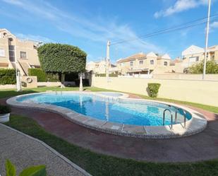 Swimming pool of Single-family semi-detached for sale in Torrevieja  with Air Conditioner, Heating and Terrace