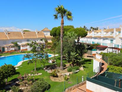 Jardí de Casa adosada en venda en El Portil amb Aire condicionat, Terrassa i Balcó