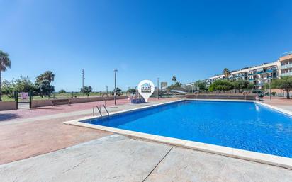 Swimming pool of Planta baja for sale in Cubelles  with Air Conditioner, Heating and Private garden