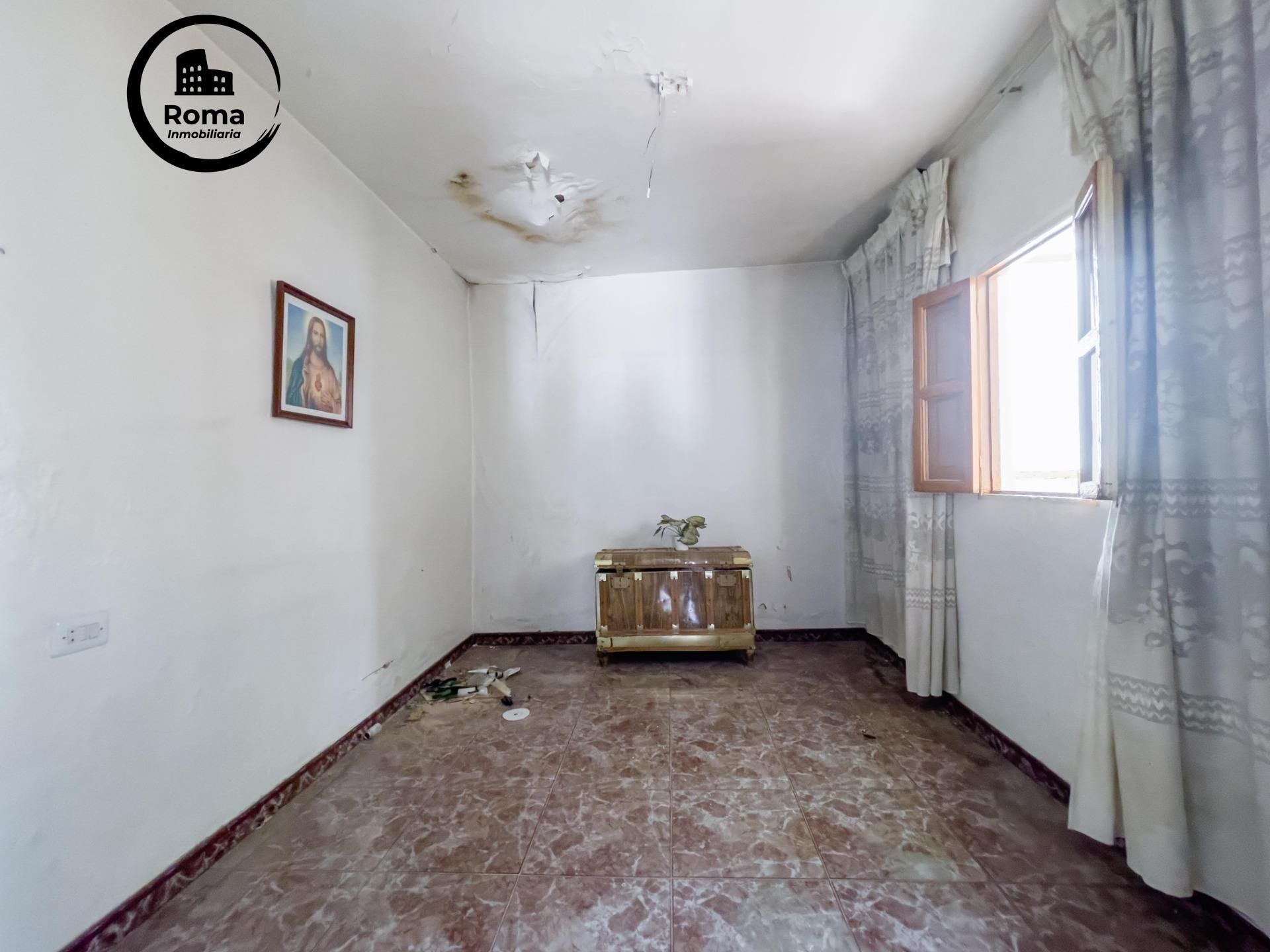 Sala de estar de Casa adosada en venta en Pinos Puente con Calefacción y Trastero