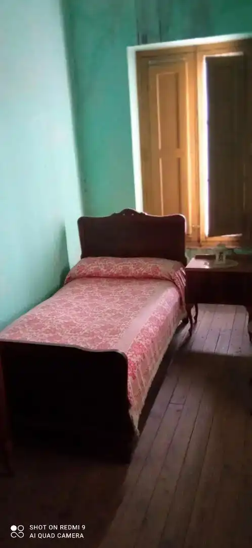 Dormitori de Casa adosada en venda en Cármenes amb Balcó