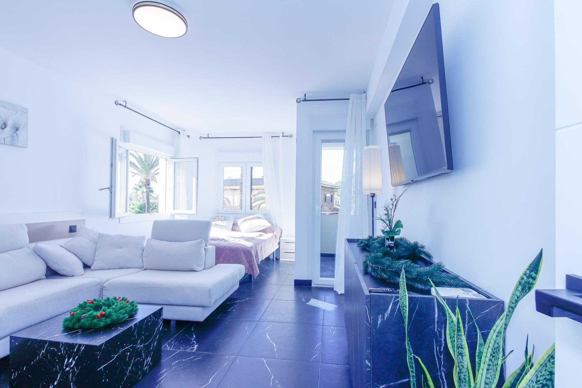 Sala d'estar de Apartament de lloguer en Orihuela amb Aire condicionat, Jardí privat i Terrassa