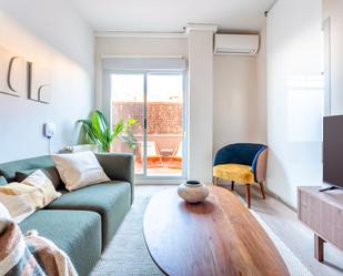 Living room of Planta baja to rent in  Madrid Capital  with Air Conditioner, Parquet flooring and Terrace