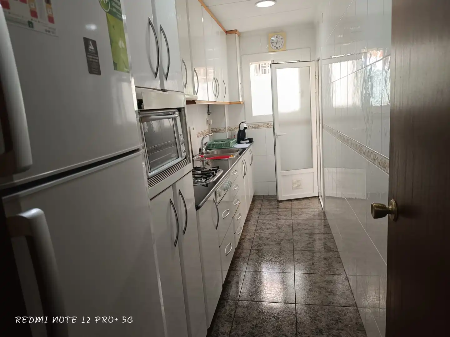 Küche von Wohnung zum Verkauf in Cunit mit Privatgarten, Terrasse und Ofen