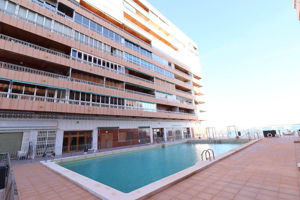 Swimming pool of Apartment for sale in Torrevieja  with Washing machine and Microwave