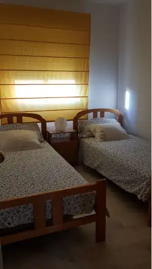 Dormitori de Pis de lloguer en Sevilla amb Aire condicionat, Terrassa i Moblat