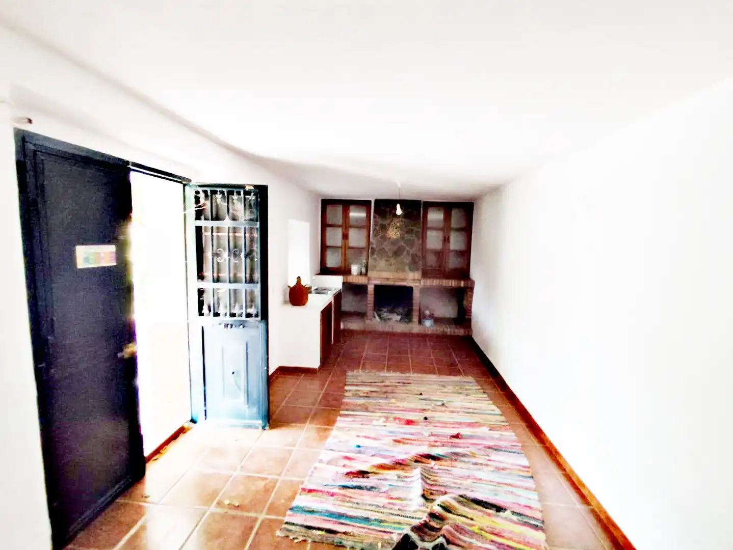 Sala de estar de Finca rústica en venta en Coín con Jardín privado, Trastero y Amueblado