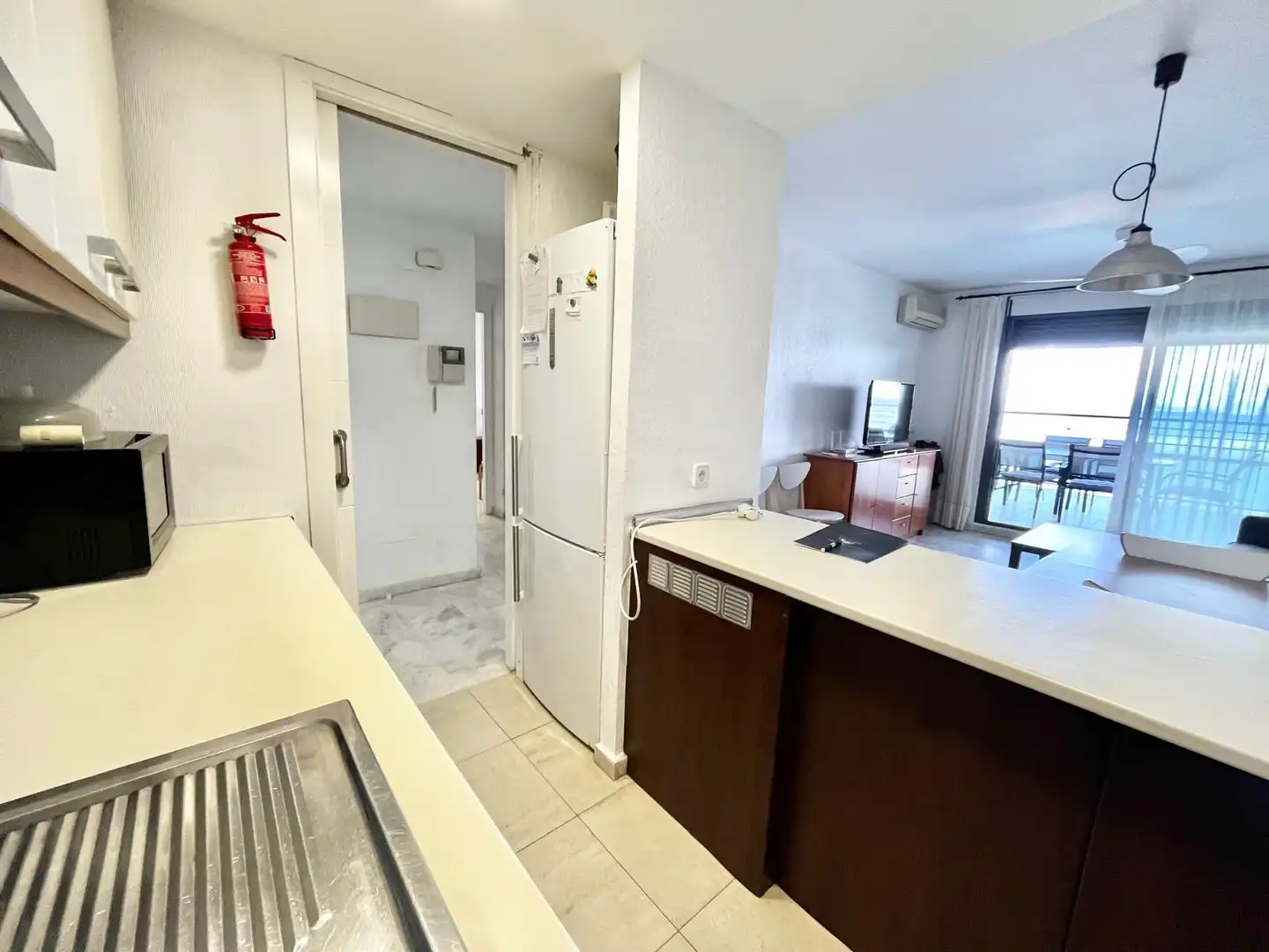 Cuina de Apartament de lloguer en La Manga del Mar Menor amb Aire condicionat, Calefacció i Piscina