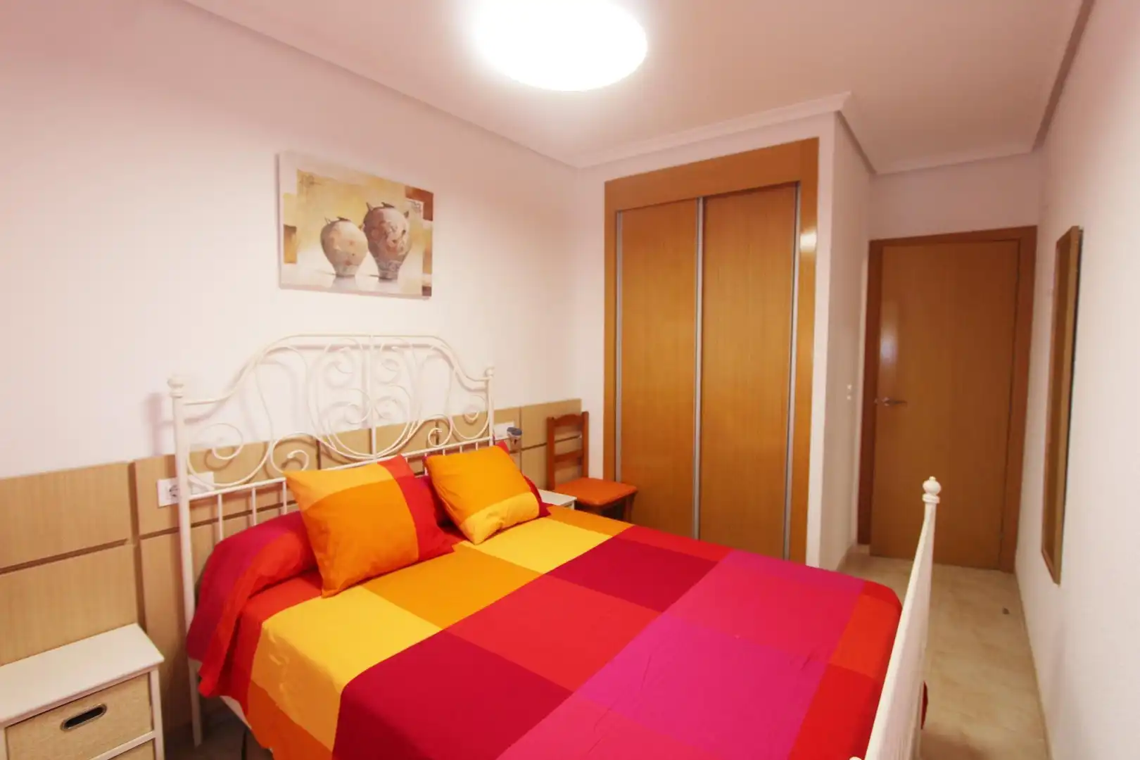 Dormitori de Apartament de lloguer en Cabanes amb Piscina comunitària