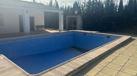 PARCELA CON CASA Y PISCINA