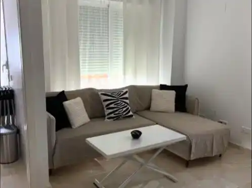 Sala d'estar de Apartament de lloguer en Oliva amb Aire condicionat, Piscina i Moblat