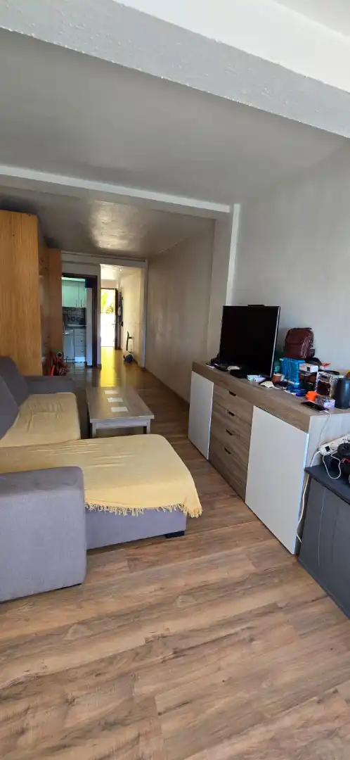 Sala d'estar de Estudi de lloguer en El Rompido amb Aire condicionat, Moblat i Forn