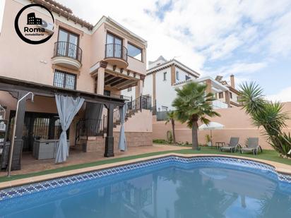 Exterior view of Single-family semi-detached for sale in La Zubia  with Air Conditioner, Heating and Private garden