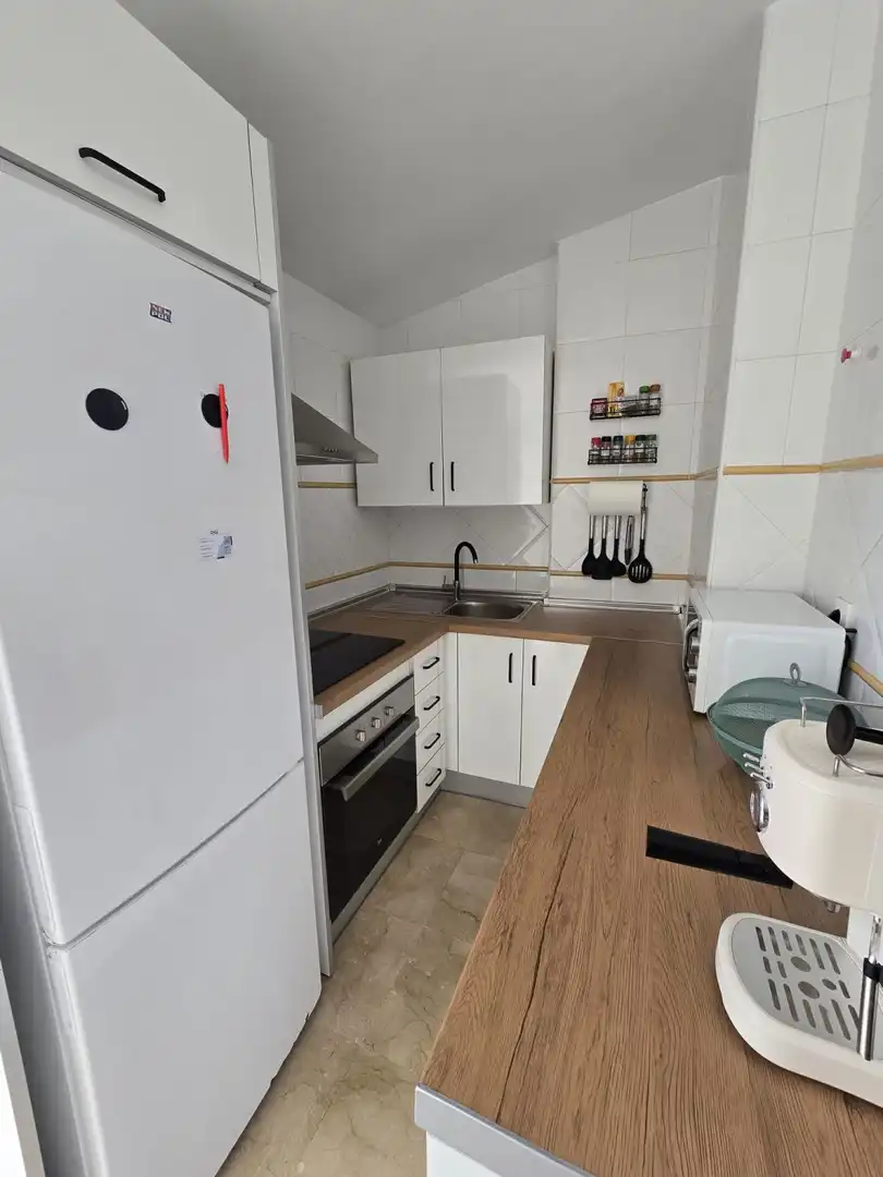 Kitchen of Attic for sale in Alcalá de Guadaira  with Air Conditioner, Terrace and Storage room