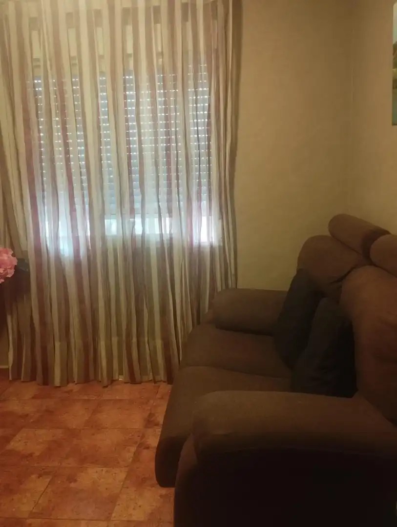 Sala d'estar de Casa adosada en venda en Casco Urbano