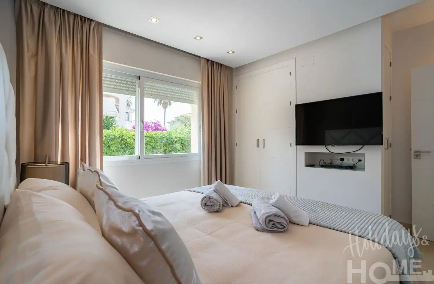 Dormitori de Pis de lloguer en Marbella amb Aire condicionat, Jardí privat i Terrassa