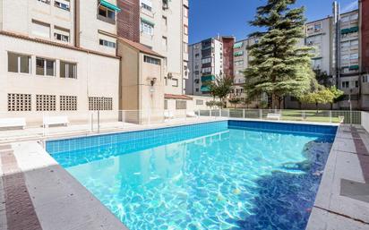 Swimming pool of Flat for sale in  Granada Capital  with Air Conditioner, Heating and Private garden