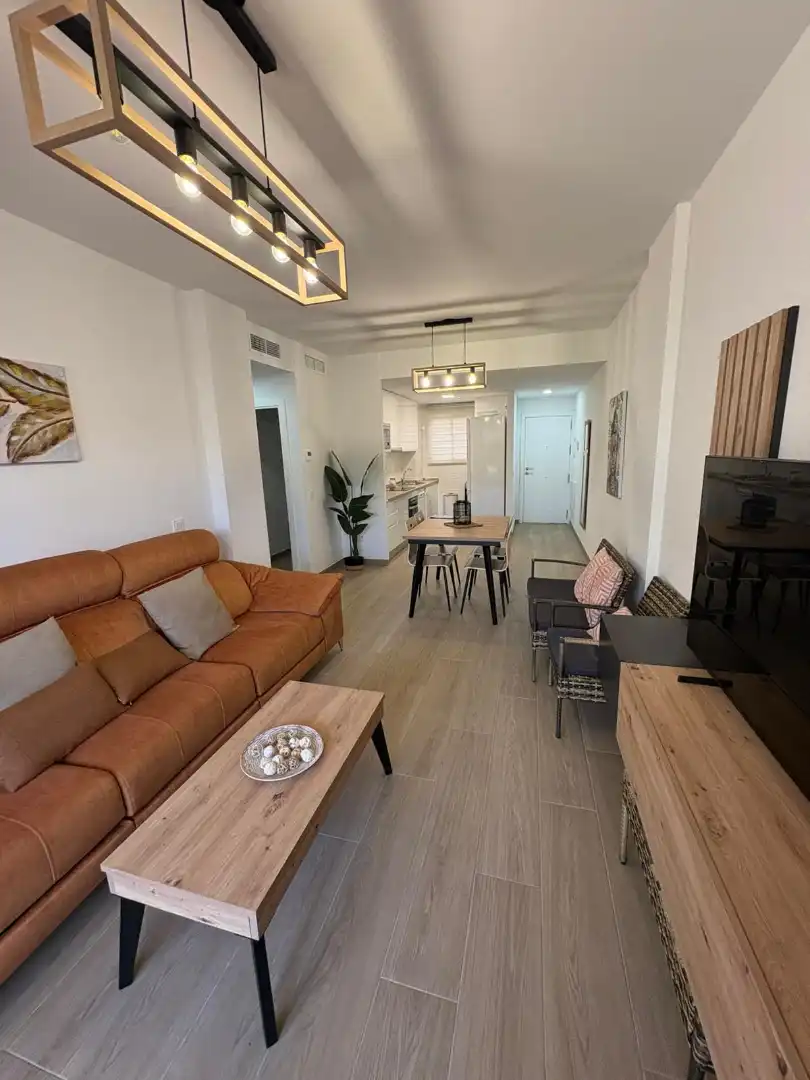 Wohnzimmer von Wohnung zum Verkauf in Chipiona mit Klimaanlage, Heizung und Privatgarten