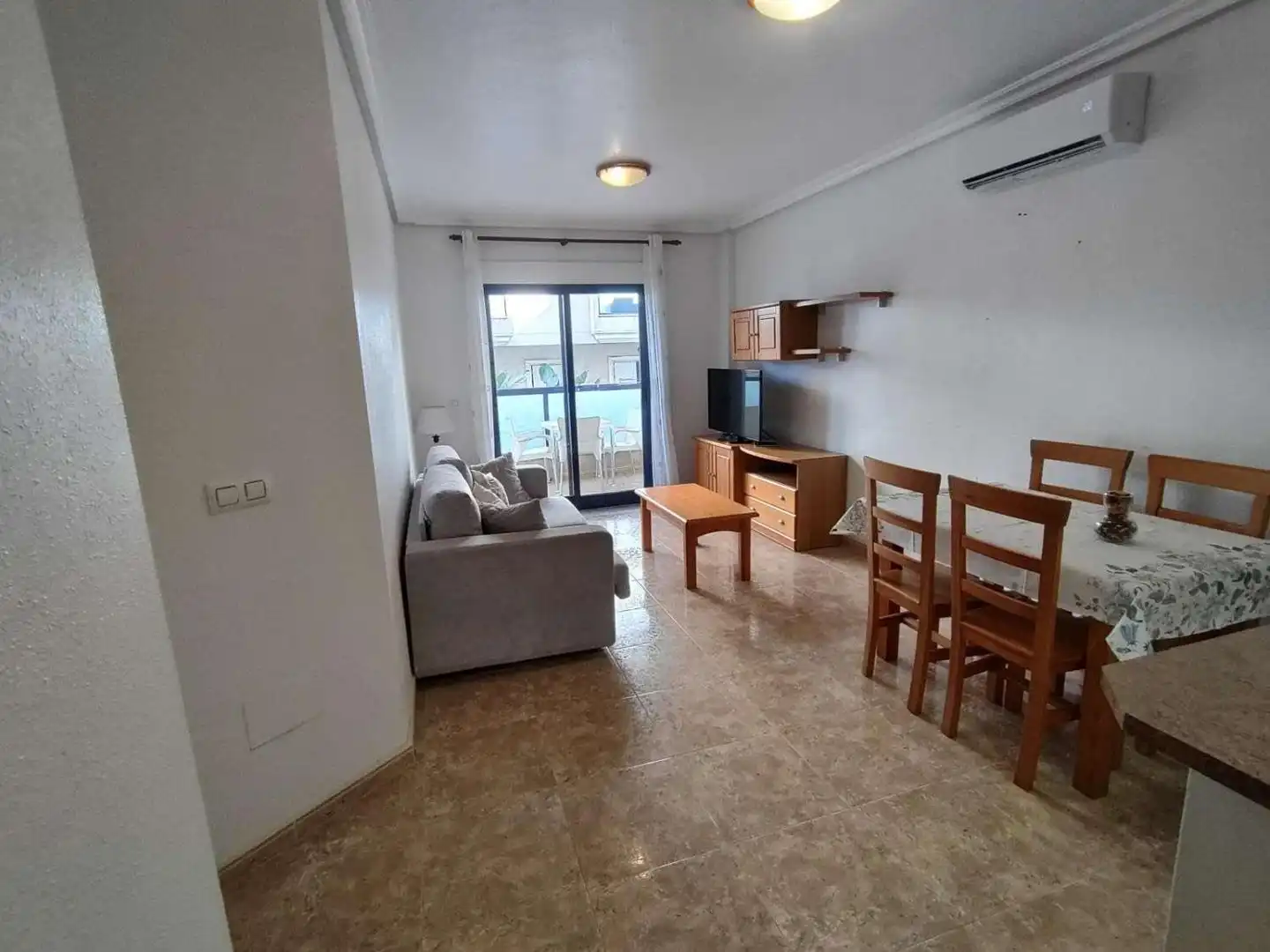 Sala d'estar de Apartament en venda en Orihuela amb Aire condicionat, Jardí privat i Terrassa