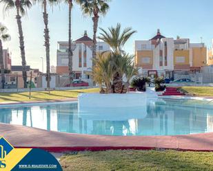 Swimming pool of Single-family semi-detached for sale in Torrevieja  with Air Conditioner, Heating and Private garden