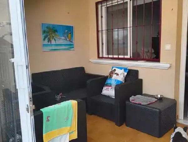 Sala d'estar de Casa adosada en venda en Orihuela amb Aire condicionat, Terrassa i Piscina