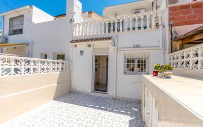 Exterior view of Single-family semi-detached for sale in Torrevieja  with Air Conditioner, Terrace and Furnished
