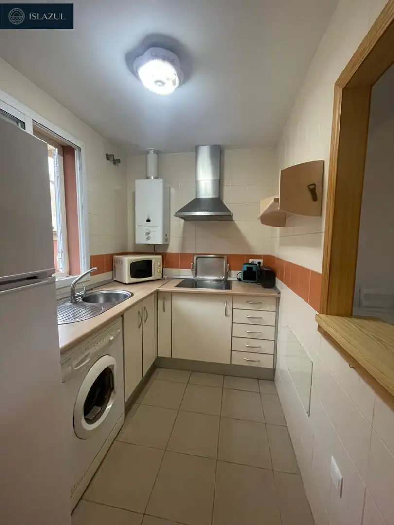 Cuina de Casa adosada en venda en Isla Cristina amb Jardí privat, Terrassa i Moblat
