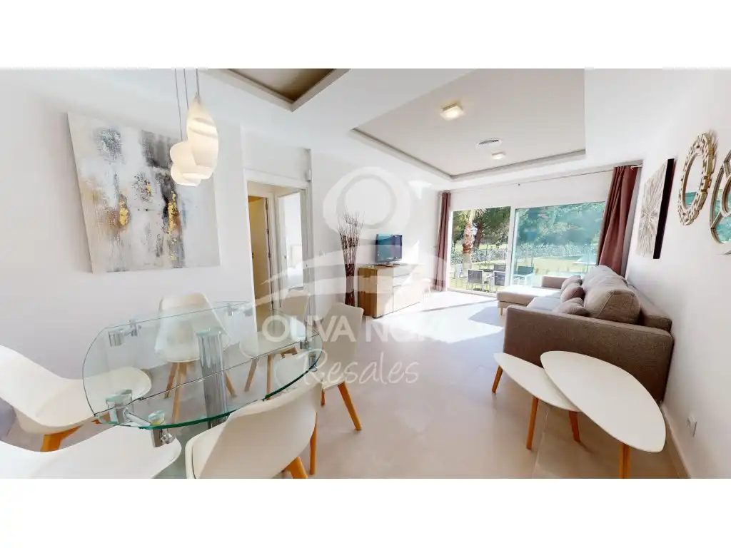 Sala d'estar de Apartament en venda en Oliva amb Aire condicionat, Jardí privat i Piscina