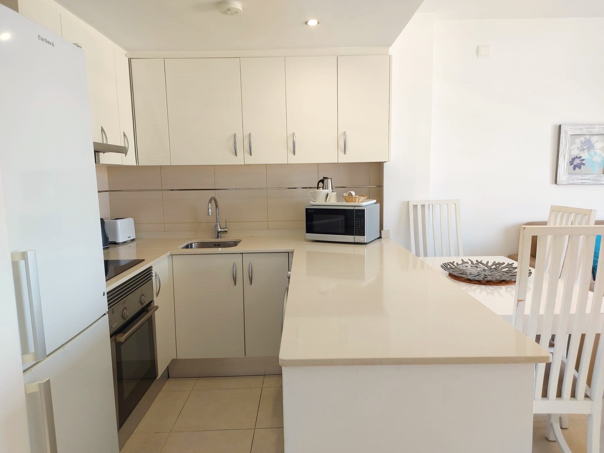 Kitchen of Flat for sale in Sant Josep de sa Talaia  with Air Conditioner, Private garden and Swimming Pool