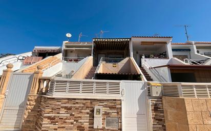 Exterior view of Single-family semi-detached for sale in Roquetas de Mar  with Air Conditioner and Terrace