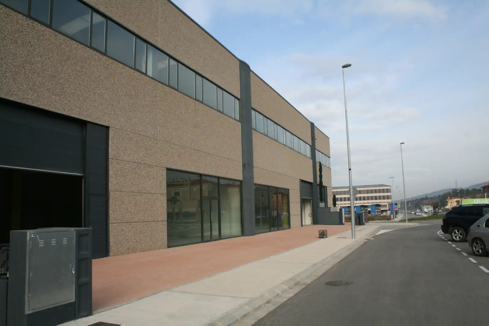 Außenansicht von Fabrik Grundstücke zum Verkauf in Quart