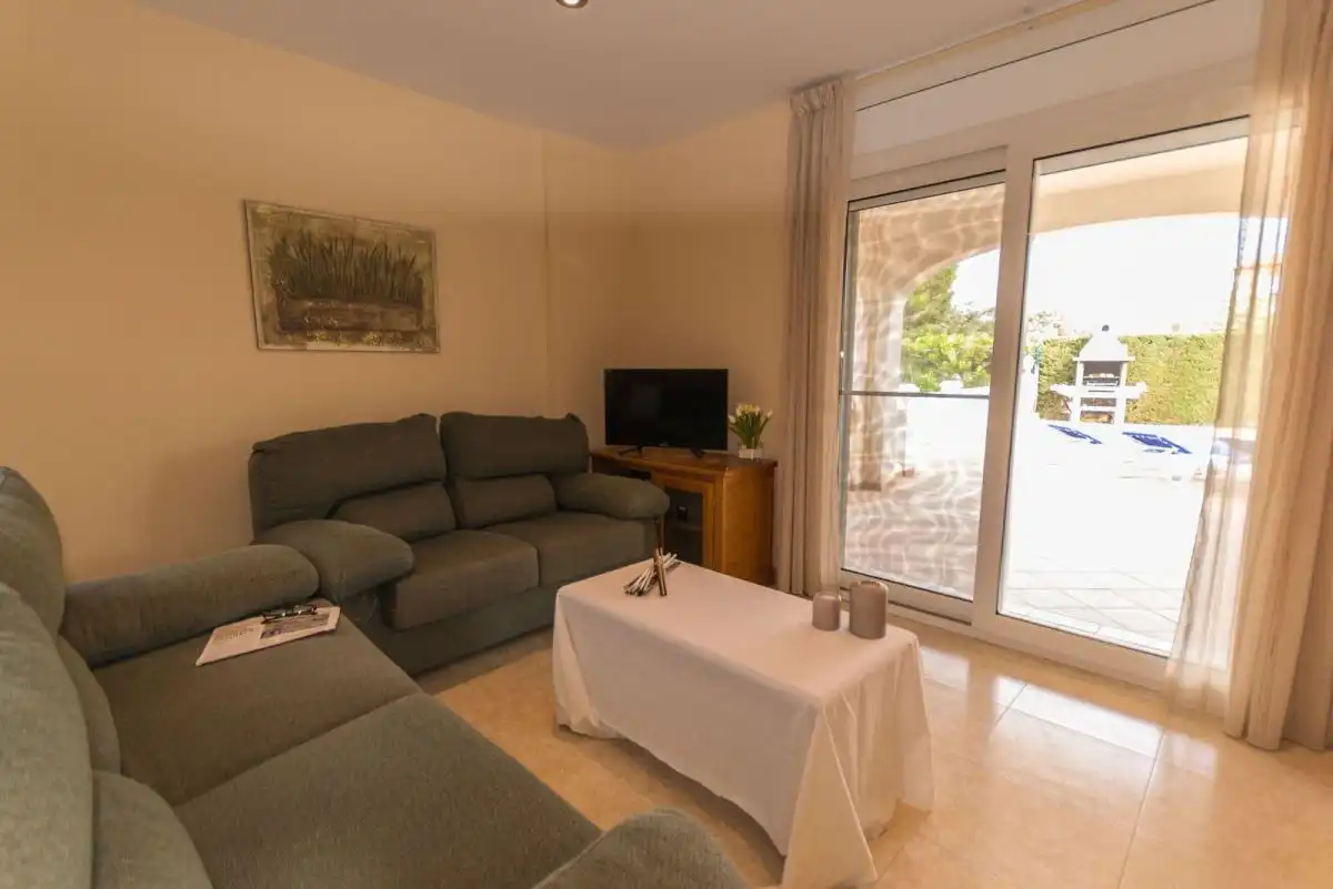 Sala de estar de Casa o chalet en venta en L'Ampolla con Aire acondicionado, Jardín privado y Terraza
