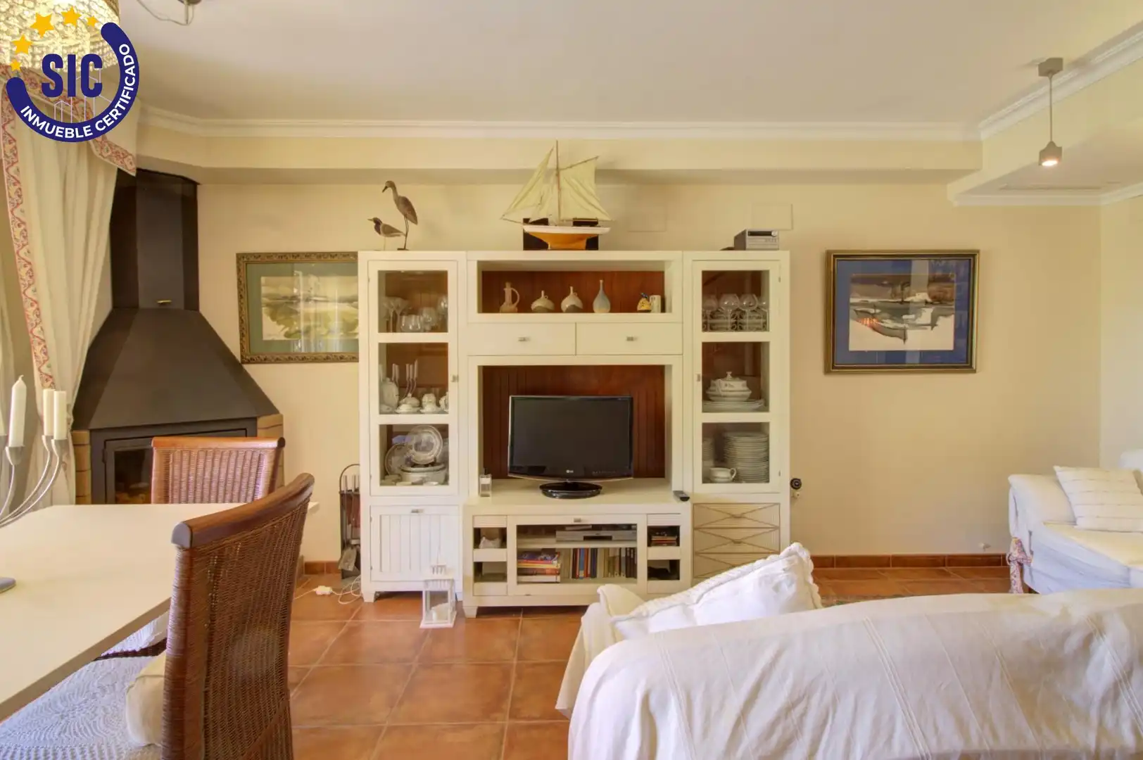Sala d'estar de Casa adosada en venda en Sagunto / Sagunt amb Aire condicionat, Calefacció i Jardí privat