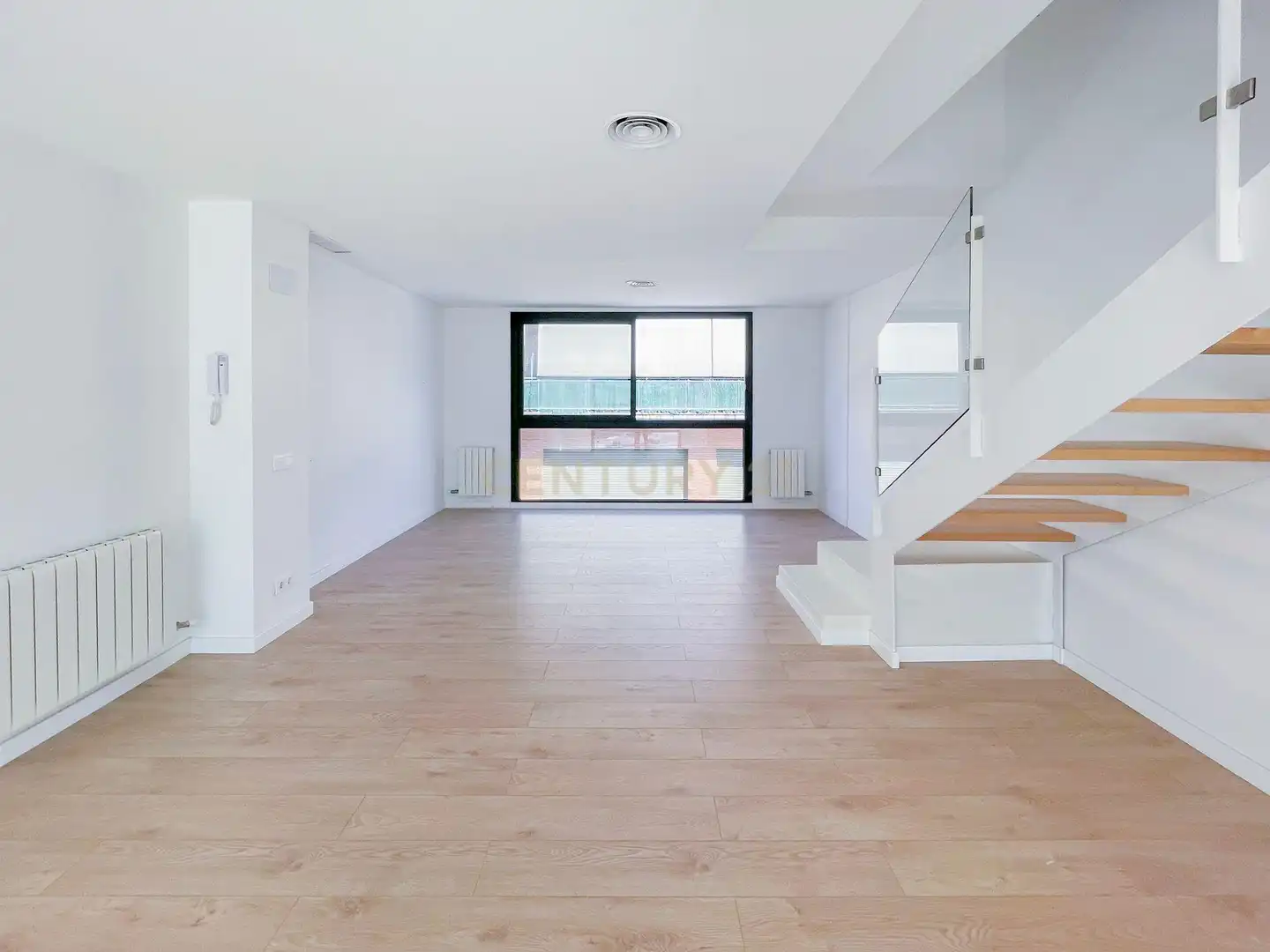 Sala d'estar de Casa adosada en venda en Hostalric