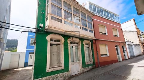 Casa adosada en el centro de Cariño.