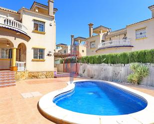Exterior view of Single-family semi-detached for sale in Guardamar del Segura  with Air Conditioner, Private garden and Terrace