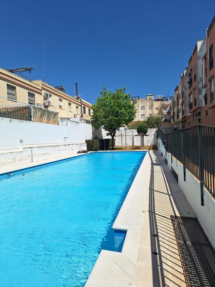 Swimming pool of Duplex for sale in Dos Hermanas  with Air Conditioner and Terrace