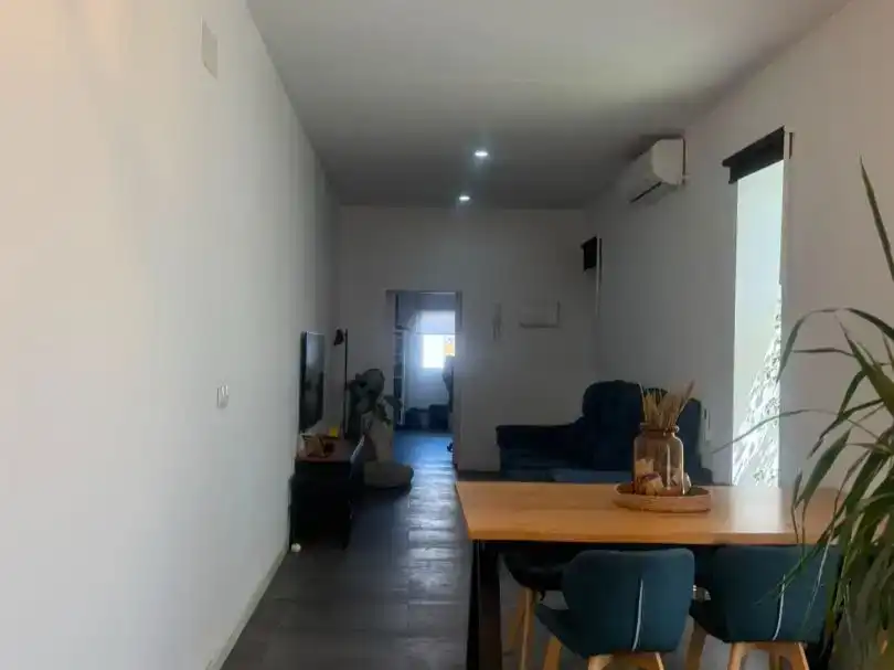 Sala d'estar de Casa adosada en venda en Alcalá de Guadaira amb Aire condicionat i Balcó
