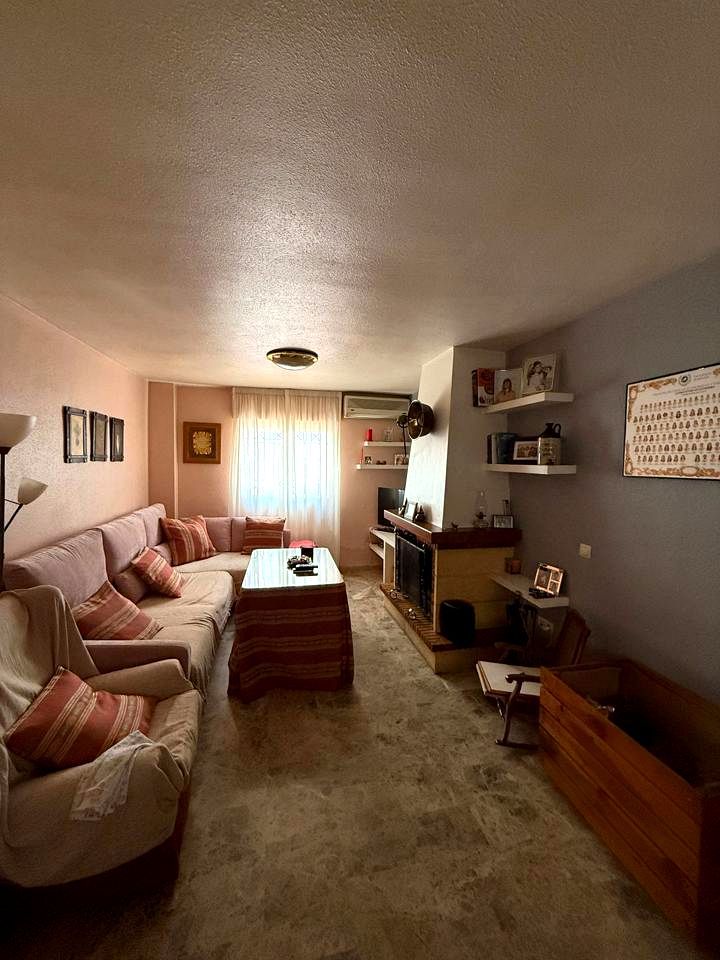 Sala de estar de Casa adosada en venta en Málaga Capital con Aire acondicionado, Terraza y Amueblado