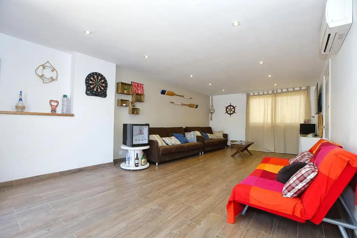 Sala de estar de Casa adosada en venta en Alcanar con Calefacción, Jardín privado y Terraza