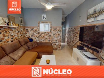 Living room of Single-family semi-detached for sale in  Almería Capital  with Air Conditioner, Heating and Terrace