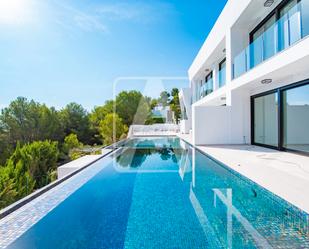 Exterior view of Single-family semi-detached for sale in Moraira  with Air Conditioner, Terrace and Swimming Pool